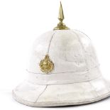 A Royal Marine Corps of Drums white pith helmet and badge