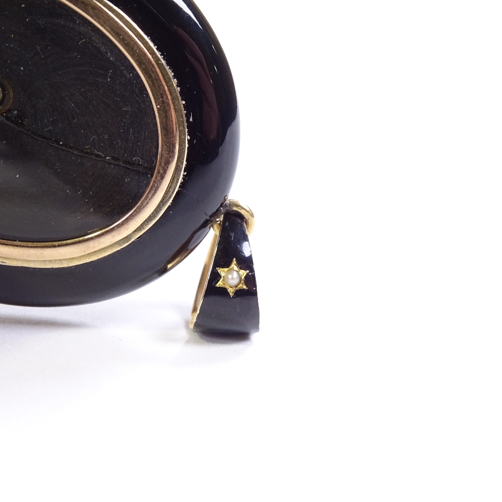 A Victorian unmarked gold black enamel split-pearl and onyx locket memorial pendant, with vacant - Image 4 of 4