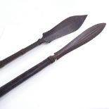 A pair of Borneo Tribal steel-tipped spears, length 195cm