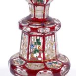 A 19th century Bohemian ruby and gilt flash glass perfume decanter, with painted floral panels,