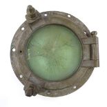 A large bronze ship's porthole, original from the steam yacht Argonaut (launched in 1879),