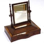 A Victorian mahogany and satinwood inlaid swing toilet mirror, with serpentine front drawer below