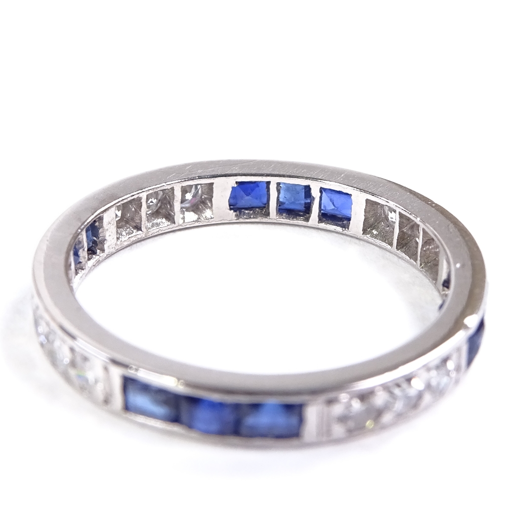 An unmarked platinum sapphire and diamond eternity ring, alternating trios of square-cut sapphires - Image 3 of 4