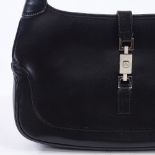 GUCCI - a smooth black leather Jackie O shoulder bag, steel hardware with front piston lock,