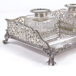 A large George V silver desk stand, with 2 silver-mounted heavy cut-glass inkwells within silver