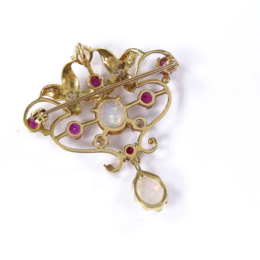 An Art Nouveau style 18ct gold opal, ruby and diamond pendant / brooch, pierced scrollwork settings, - Image 4 of 4