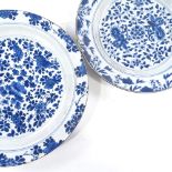2 Chinese blue and white porcelain plates, largest 30cm across Larger plate has a 6cm hairline