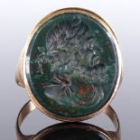 A 9ct gold bloodstone intaglio carved seal ring, depicting Greek male portrait with laurel wreath,