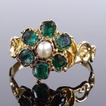 A Victorian unmarked gold green tourmaline and split-pearl flowerhead memorial ring, scrollwork