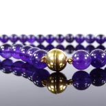 A modern polished amethyst bead necklace, silver-gilt clasp, necklace length 55cm, 79.8g Very good