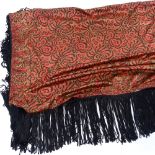 A Chinese hand embroidered red ground floral design silk scarf with black fringe, panel size 136cm x