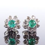 A pair of 18ct white gold emerald and diamond cluster earrings, total diamond content approx 0.15ct,