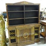 A Regency rosewood library bookcase of small size, with open bookshelves above and brass lattice