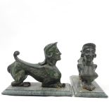 A pair of Victorian green painted cast-iron winged sphinx design firedogs on green marble bases,