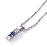 An 18ct white gold 3-stone sapphire and diamond line pendant necklace, on 18ct box-link chain, total