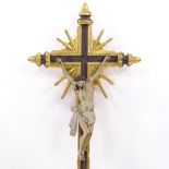 A 19th century carved painted and gilded wood crucifix, height 94cm