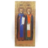 A Russian painted and gilded icon, 18th or 19th century, depicting 2 saints with Cyrillic