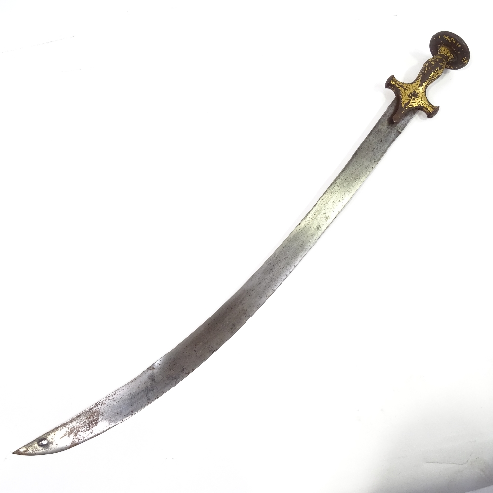 A Middle Eastern curved sword with gilded iron handle, 18th or 19th century - Image 2 of 3