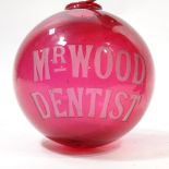 A 19th century ruby glass advertising shade, etched inscription "Mr Wood Dentist", diameter 28cm