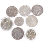 A collection of 19th and 20th century American silver dollars and half dollar coins