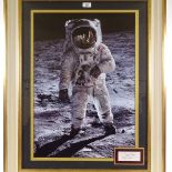 A large format photographic portrait of Buzz Aldrin on the moon, with inset original signature card,