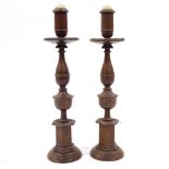A pair of 19th century rosewood candle holders, height 39cm