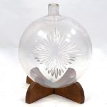 A large Victorian blown glass Chemist's carboy with wheel-cut star emblem, on wooden stand,