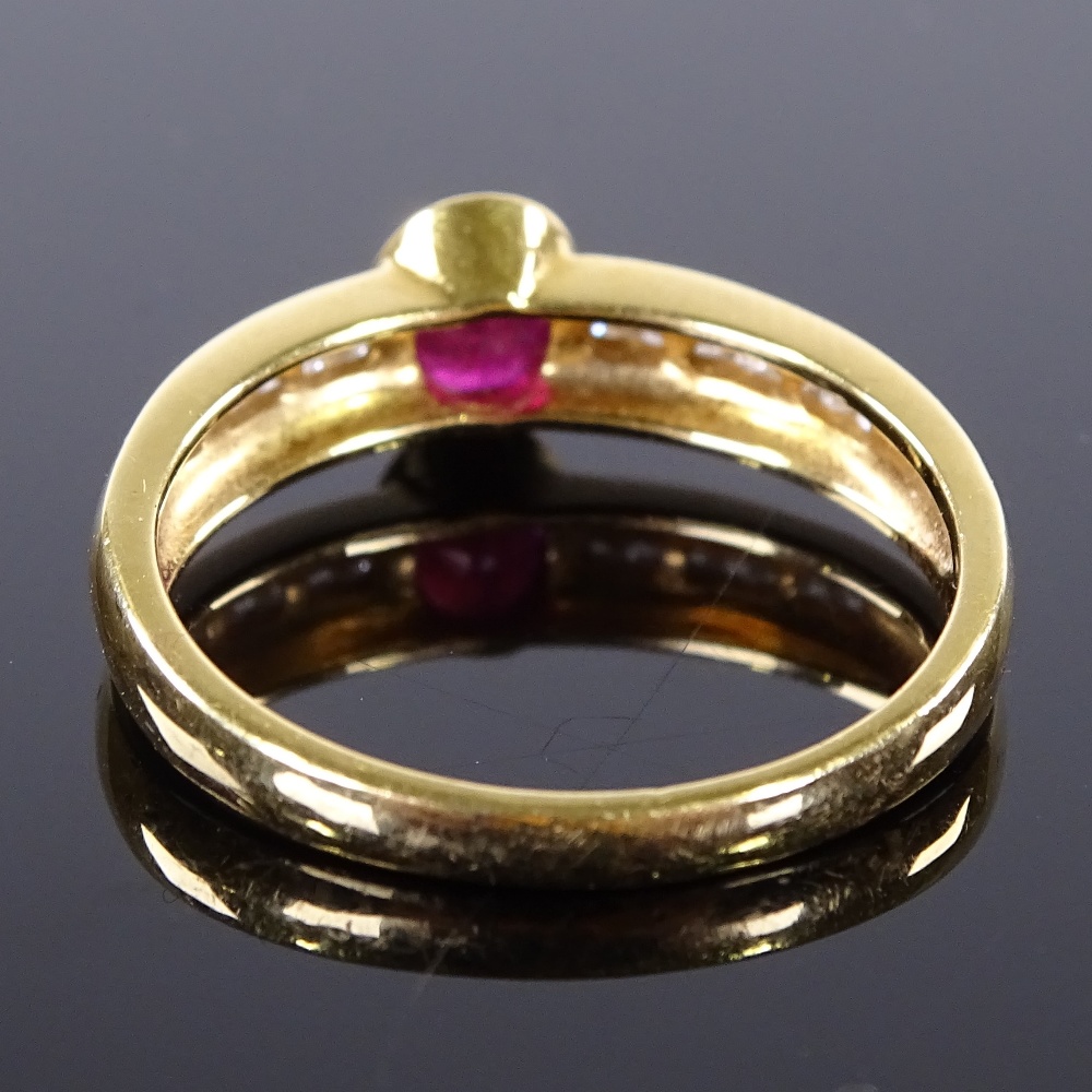 An 18ct gold ruby and diamond band ring, channel set diamond shoulders, setting height 6.2mm, size - Image 2 of 4