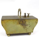 A 19th century brass tavern honesty tobacco dispenser, length 26cm