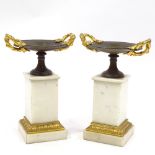 A pair of 19th century parcel gilt-bronze 2-handled tazza on bronze-mounted white marble