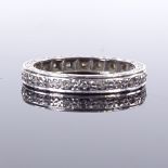 An 18ct white gold diamond eternity ring, total diamond content approx 0.1ct, band width 2.7mm, size