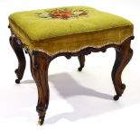 A Victorian square rosewood upholstered dressing stool, with carved frieze and brass casters