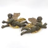 A pair of 19th century carved painted and gilded wood flying cherub ornaments, length 68cm