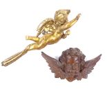A 19th century carved painted and gilded wood cherub ornament, length 52cm, and a 19th century