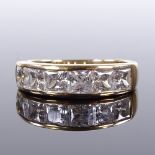 A 9ct gold 6-stone princess-cut CZ half eternity ring, maker's marks OPT, setting height 5.3mm, size