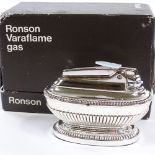 A Ronson Varaflame gas chrome table lighter, length 9cm, original box Very good original unusued