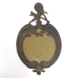 A 19th century relief cast patinated bronze frame, surmounted by a globe and navigational tools,