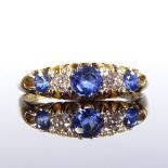 An 18ct gold 5-stone sapphire and diamond half-hoop ring, maker's marks RAJ and S, total diamond