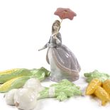A Lladro porcelain woman with parasol, height 21cm, and 3 ceramic vegetable ornaments (4) All in