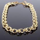 An unmarked gold double-link bracelet, bracelet length 17cm, 9g (missing clasp) Good overall