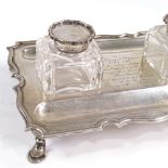 A George VI silver desk stand, with two silver-mounted cut-glass inkwells and pen recesses, raised