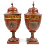 A pair of painted and gilded wooden ornamental urns and covers in Adam style, probably mid-20th
