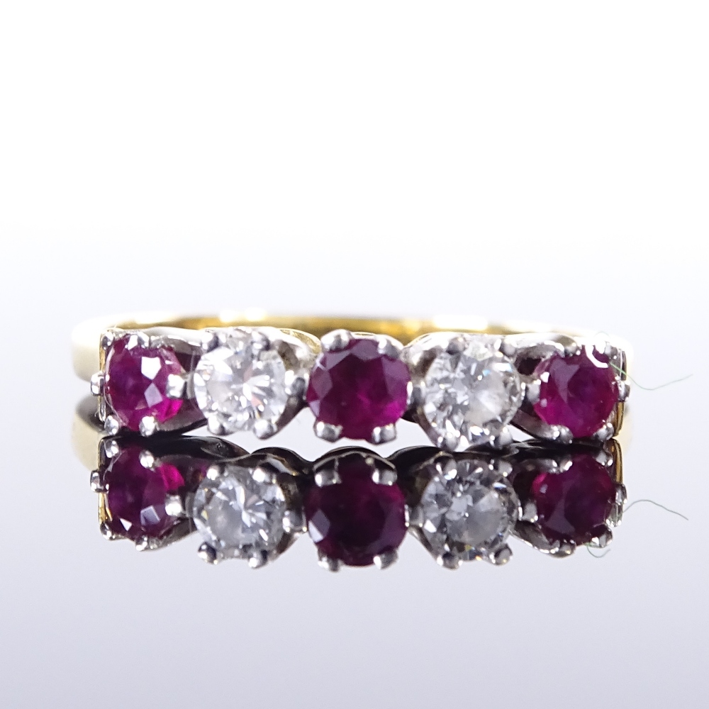 An 18ct gold 5-stone ruby and diamond half-hoop ring, total diamond content approx 0.12ct, maker's