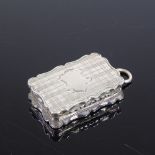 A Victorian silver vinaigrette, shaped rectangular form with cross-hatch engine turned decoration,