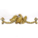 A 19th century carved giltwood heraldic eagle design pediment with bell flower and ribbon swags, 1.