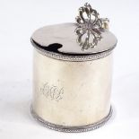 A Victorian silver mustard pot, beaded border with scrolled C acanthus leaf handle and shell