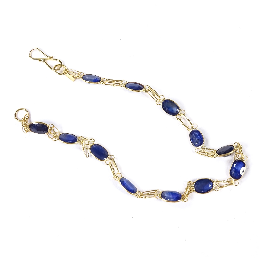 An unmarked gold oval-cut sapphire line bracelet, bracelet length 19cm, 2.3g Good original - Image 3 of 4