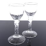 A pair of George III ale glasses with facet-cut stems, height 13cm