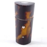 A tortoiseshell and silver-mounted thimble case, height 5cm, containing an Edwardian silver thimble,