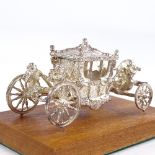 A novelty miniature silver Coronation carriage model, by Toye, Kenning & Spencer Limited,